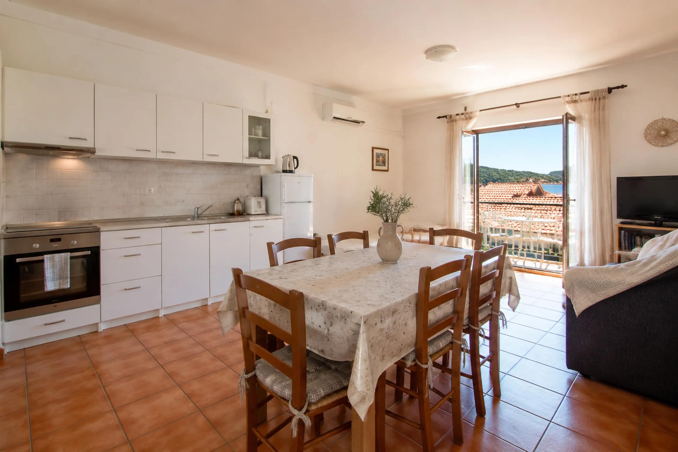 The living room opens directly onto the terrace